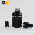 botella de vidrio cosmética negra 50ml con bomba de loción de aluminio